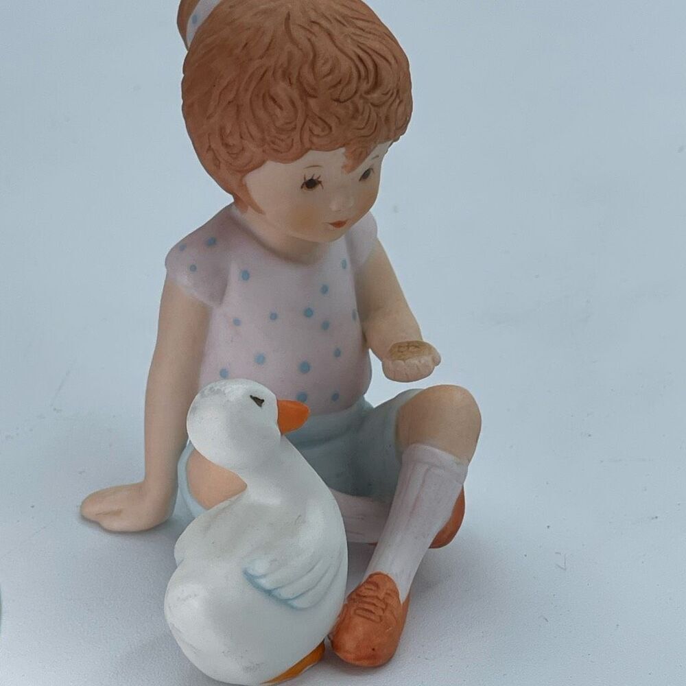 Vintage “Perfect Pals” ceramic figurine little girl and a duck.